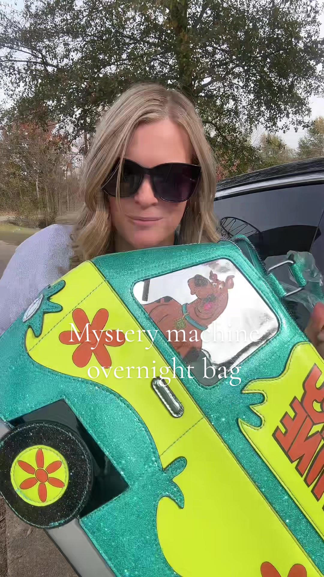 TikTok post by @1985chelle for Dolls Kill. Caption reads: Mystery machine overnight bag. @Dolls Kill....