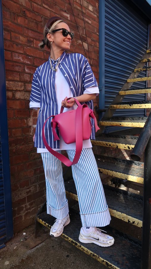 Instagram post by @goodmannersstyle for ANINE BING. Caption reads: Styling stripes for spring 💛 which is your fave....