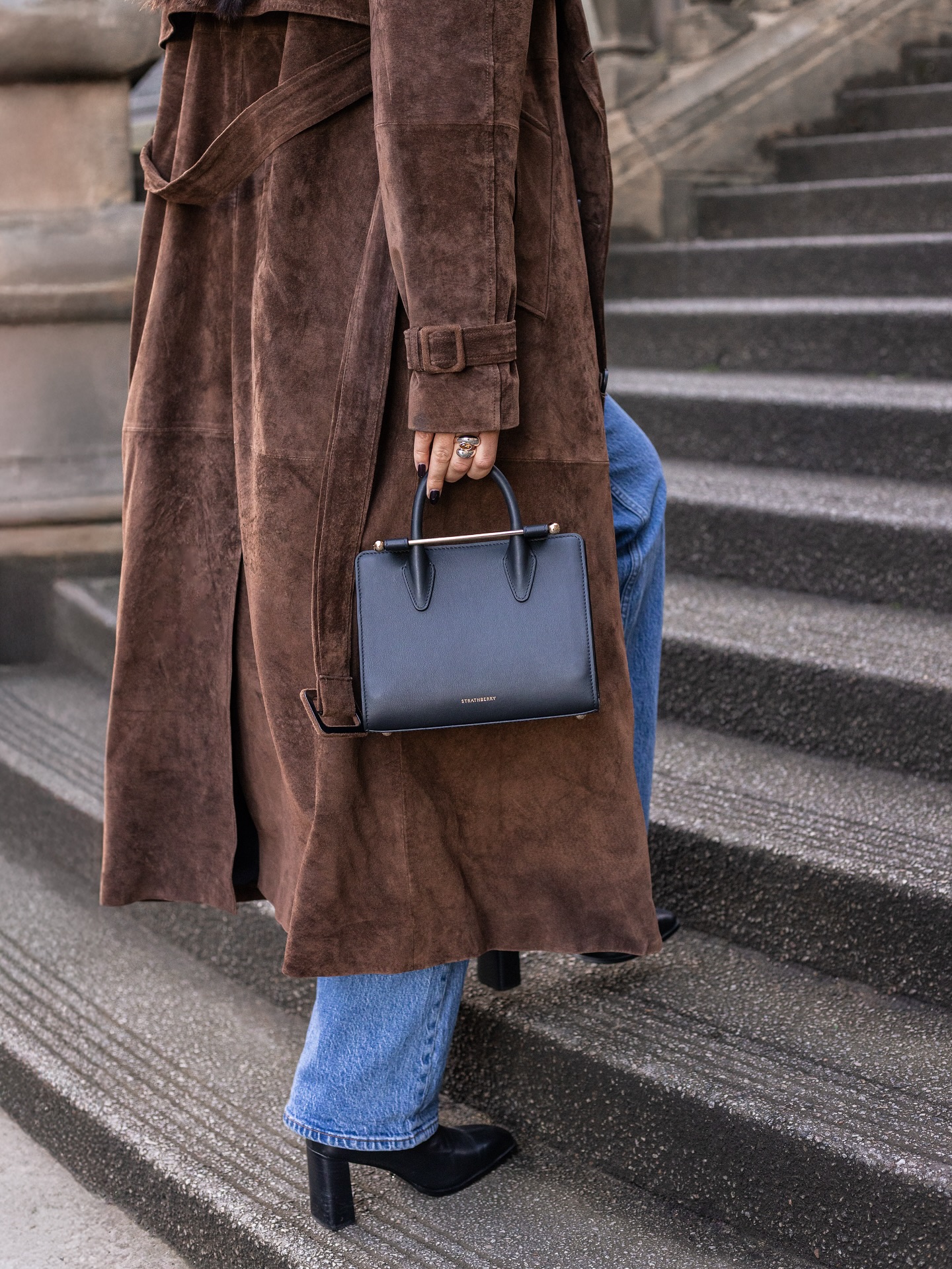 Instagram post by @mary.cj.skinner for Strathberry. Caption reads: me and my mini tote against the world @strathberry....