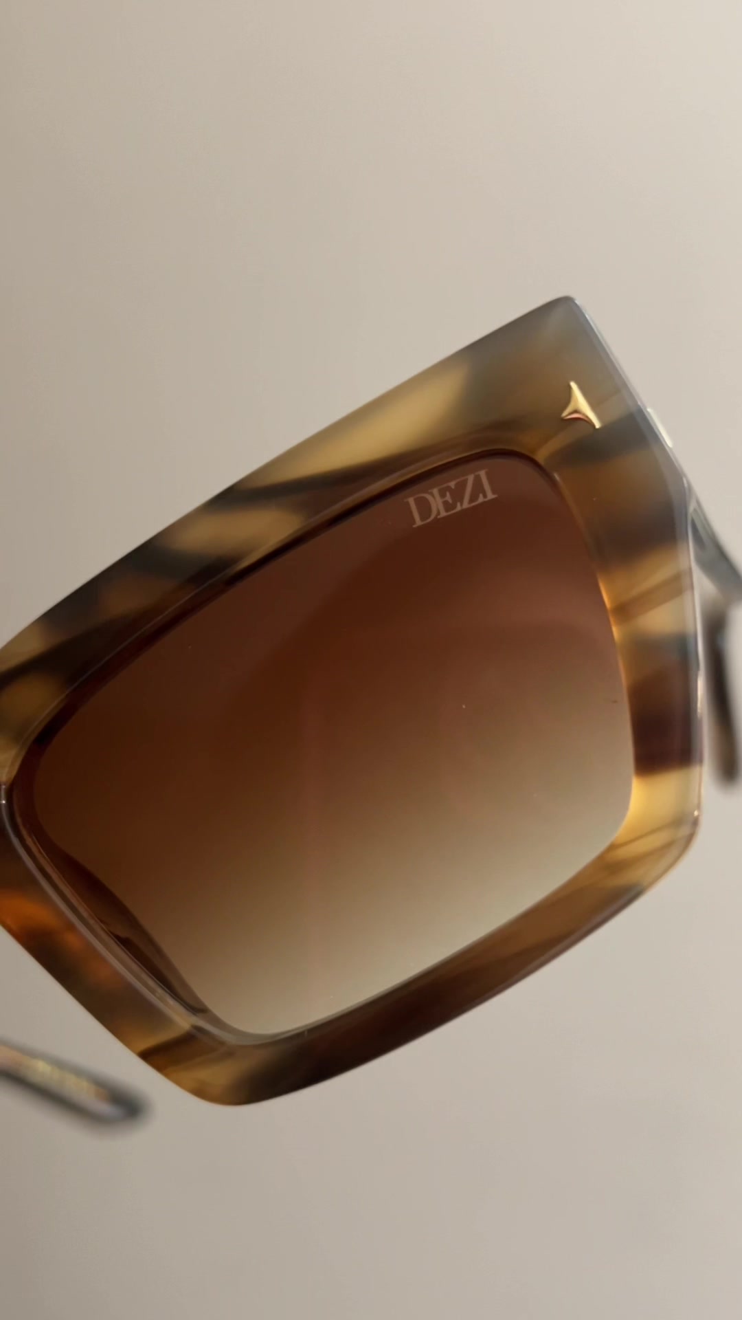 TikTok post by @itscharlie2u for DEZI. Caption reads: How stunning are these DEZI “Switch” shades?! I....