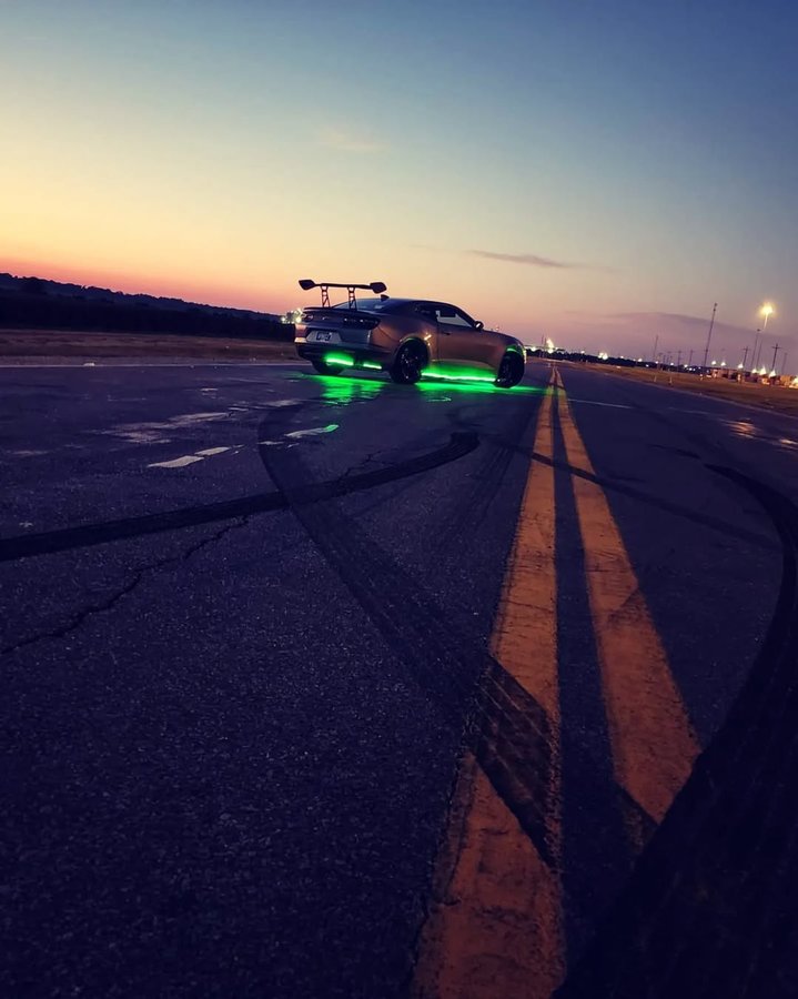 Instagram post by @teamvibetribe for Nitrous Outlet. Caption reads: Merry X-mas From The Stallion's And Panic
 🏎💨.