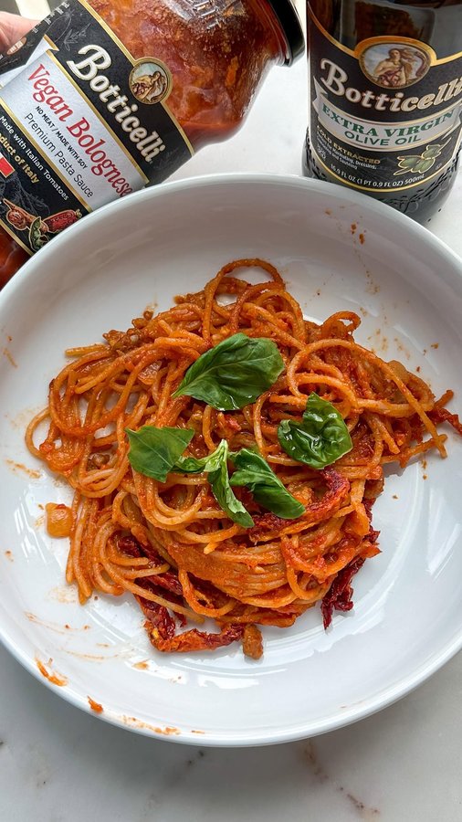 Instagram post by @thebowladdict for Botticelli Foods. Caption reads: Vegan bolognese using @botticellifoods vegan....