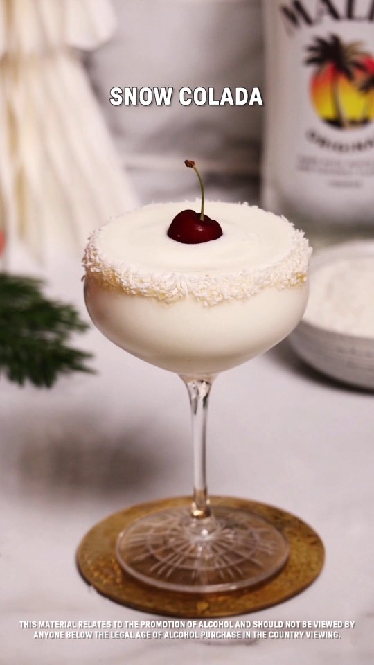 Instagram post by @my_cocktail_bible for Malibu Drinks. Caption reads: This Piña Colada is officially snow day approved....