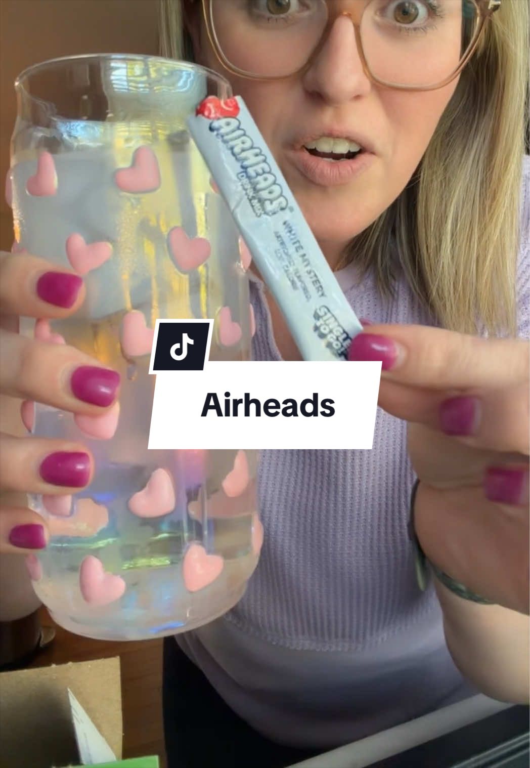 TikTok post by @thedailywith_kaylee for Singles To Go. Caption reads: [...] Airheads in drink form! So so good! @Singles....