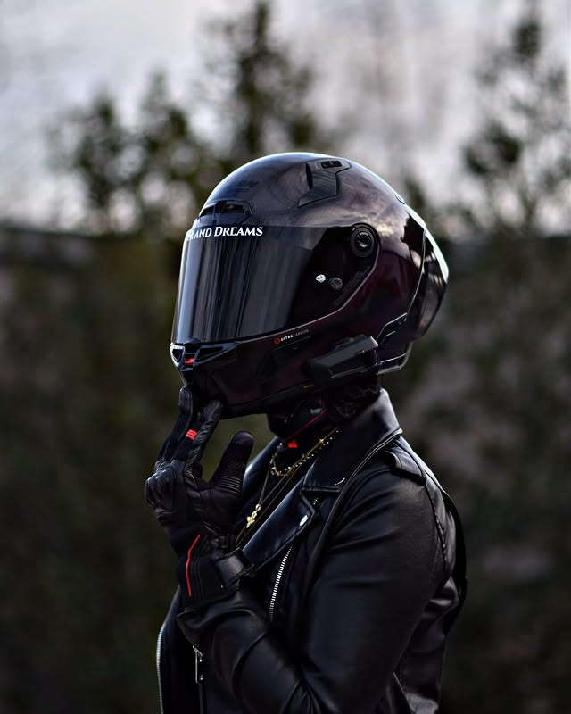 Instagram post by @nastyriders for Cardo Systems. Caption reads: [...] 🖤 📸 @skyrydes • #bikergirl #helmet....