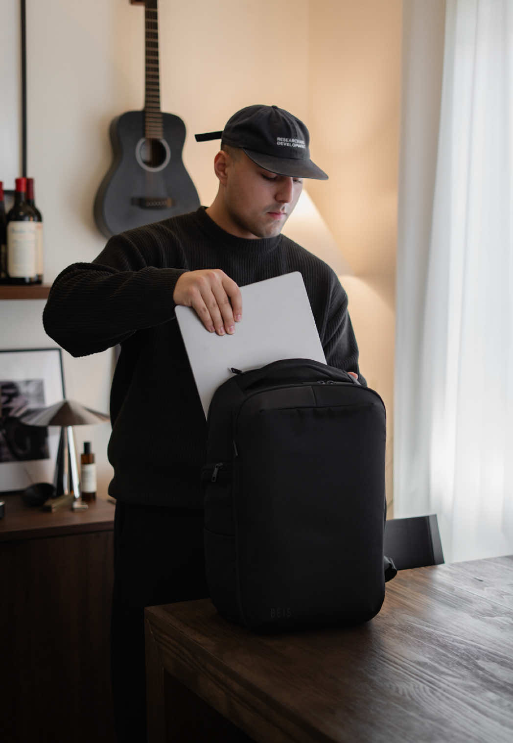 TikTok post by @stelioskroudis for BÉIS Travel. Caption reads: Pack clothes for a weekend trip, camera gear for a....