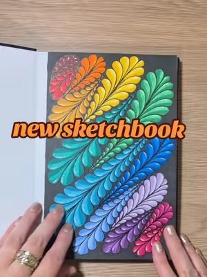 TikTok post by @doodlewithrachel for Ohuhu. Caption reads: [...] introducing my new sketchbook from ohuhu. so....