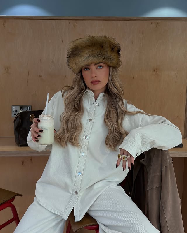 Instagram post by @bethanmccoy for PrettyLittleThing. Caption reads: silly hats, banana bread matcha, lip oil <333 i’m....