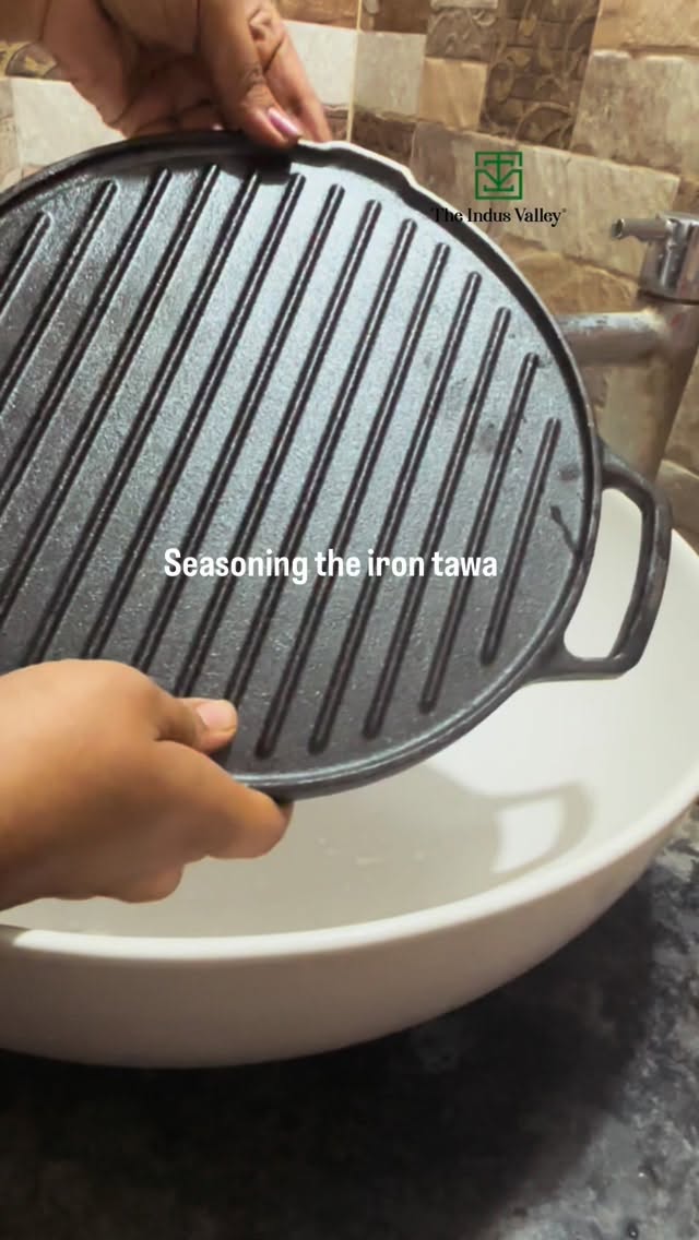 Instagram post by @laxmi_shedabal for The Indus Valley. Caption reads: seasoning cast iron tawa.
.
.
💚 The Indus Valley:....