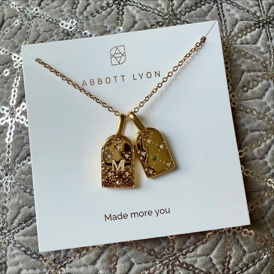 Instagram post by @meggieapples for Abbott Lyon. Caption reads: In love with this gorgeous double monogram tag....