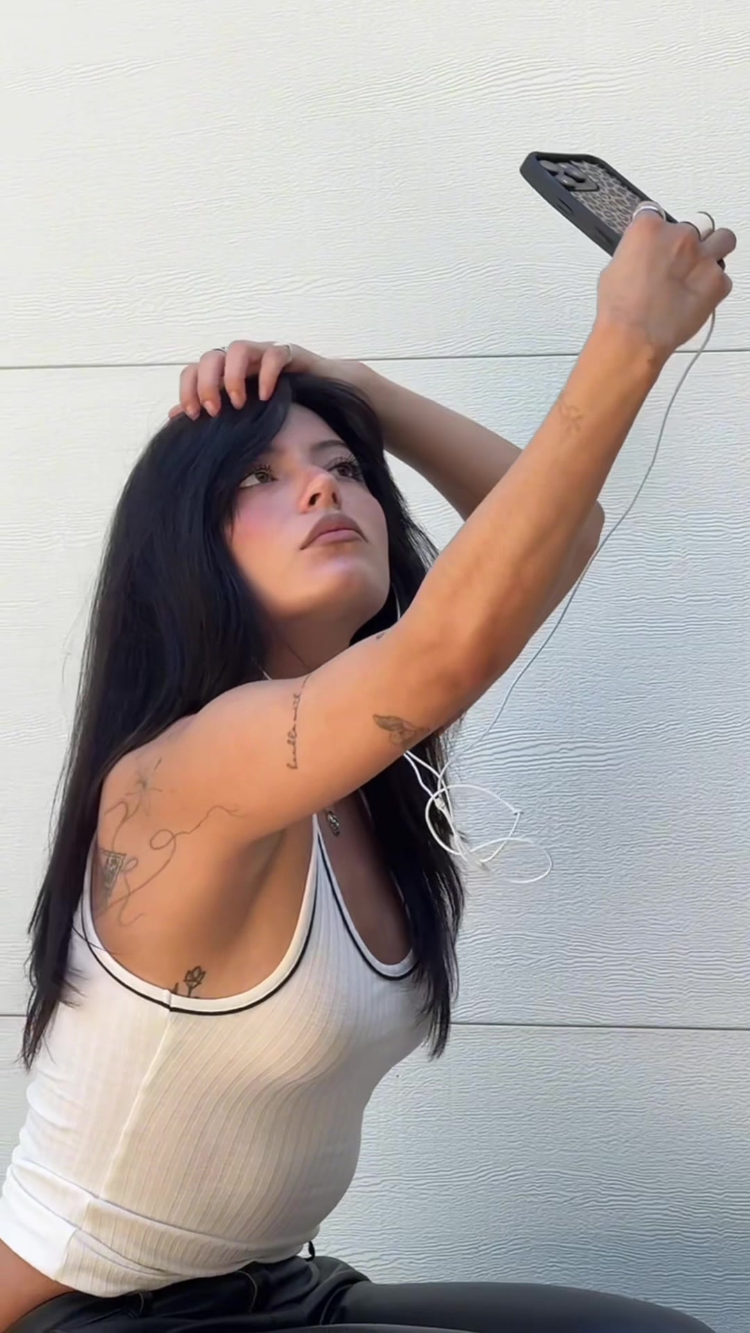 TikTok post by @sabquesada for H&M. Caption reads: Making little me proud @H&M SS26 #ad.
