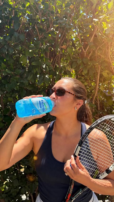 Instagram post by @camillemejia for Electrolit. Caption reads: Get ready with me for tennis with @electrolit....