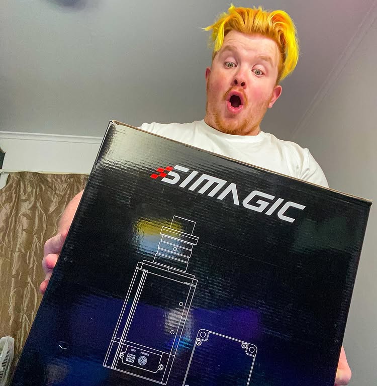 Instagram post by @radalivee for Simagic. Caption reads: [...] I’ve proudly partnered with @simagicofficial....