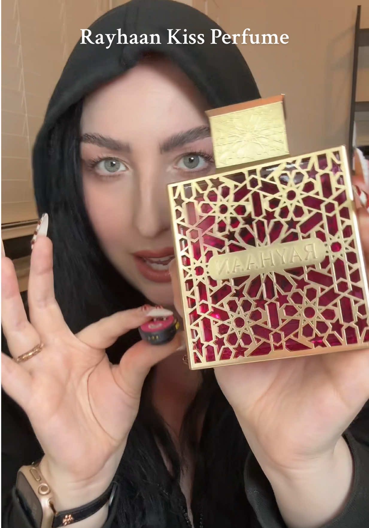 TikTok post by @itsari_b for Beauty House. Caption reads: [...] 💋 #rayhaankiss #perfumereview #beautyhouse....