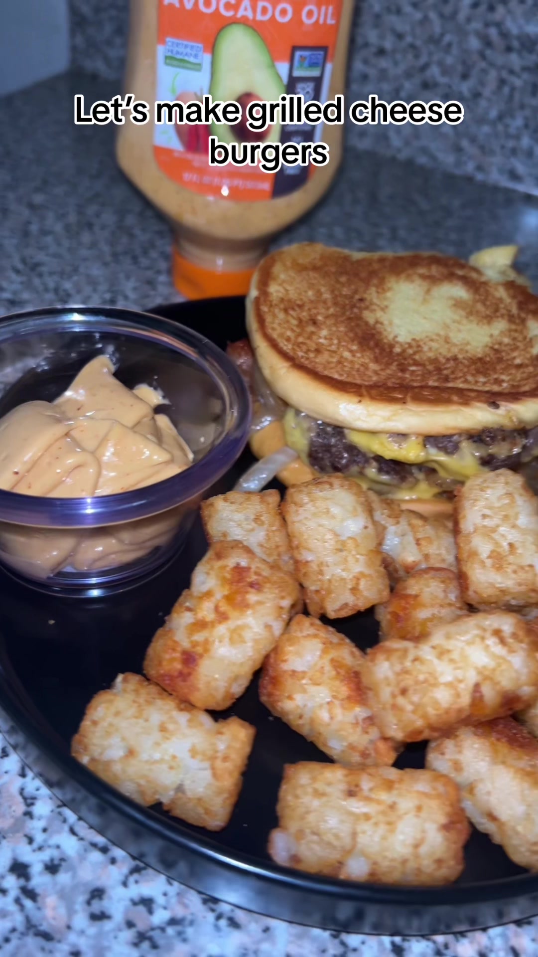 TikTok post by @kayllalewispt2 for Mark's Daily Apple. Caption reads: Grilled cheese burgers w/ @Primal Kitchen Buffalo....
