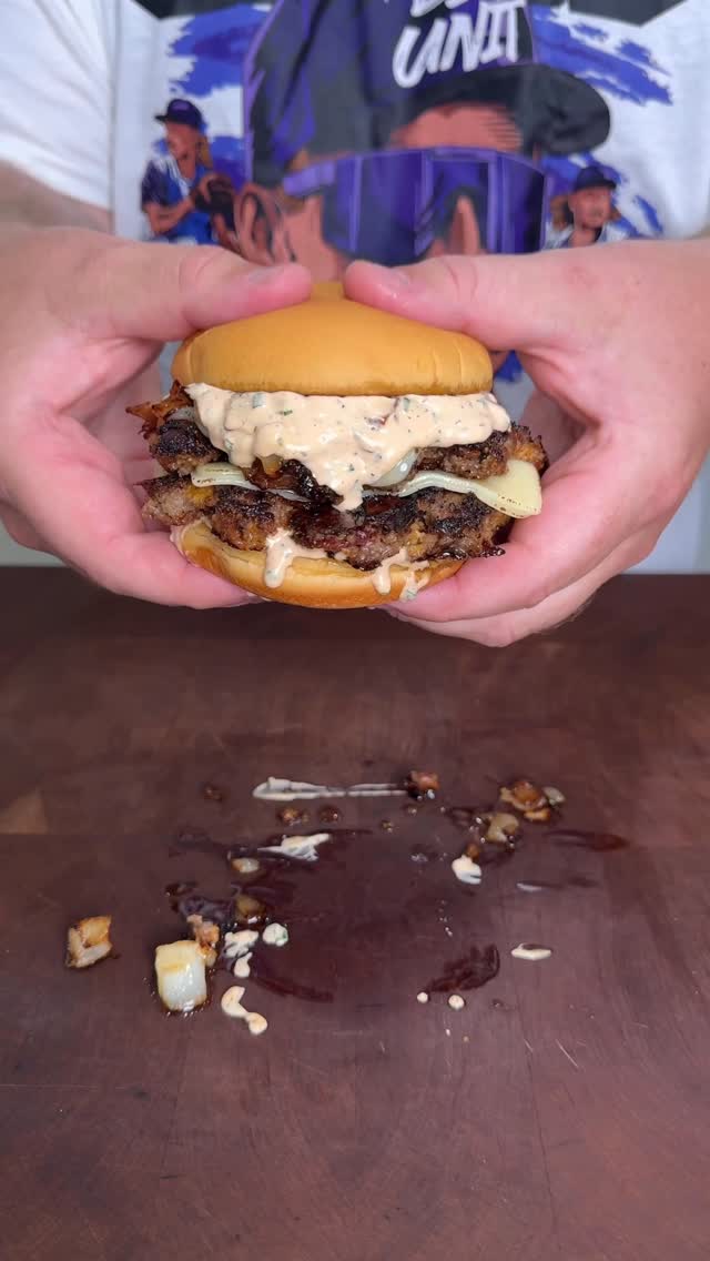 Instagram post by @g_bque for Pit Boss Grills. Caption reads: The Viral Crack Burger - This was so....