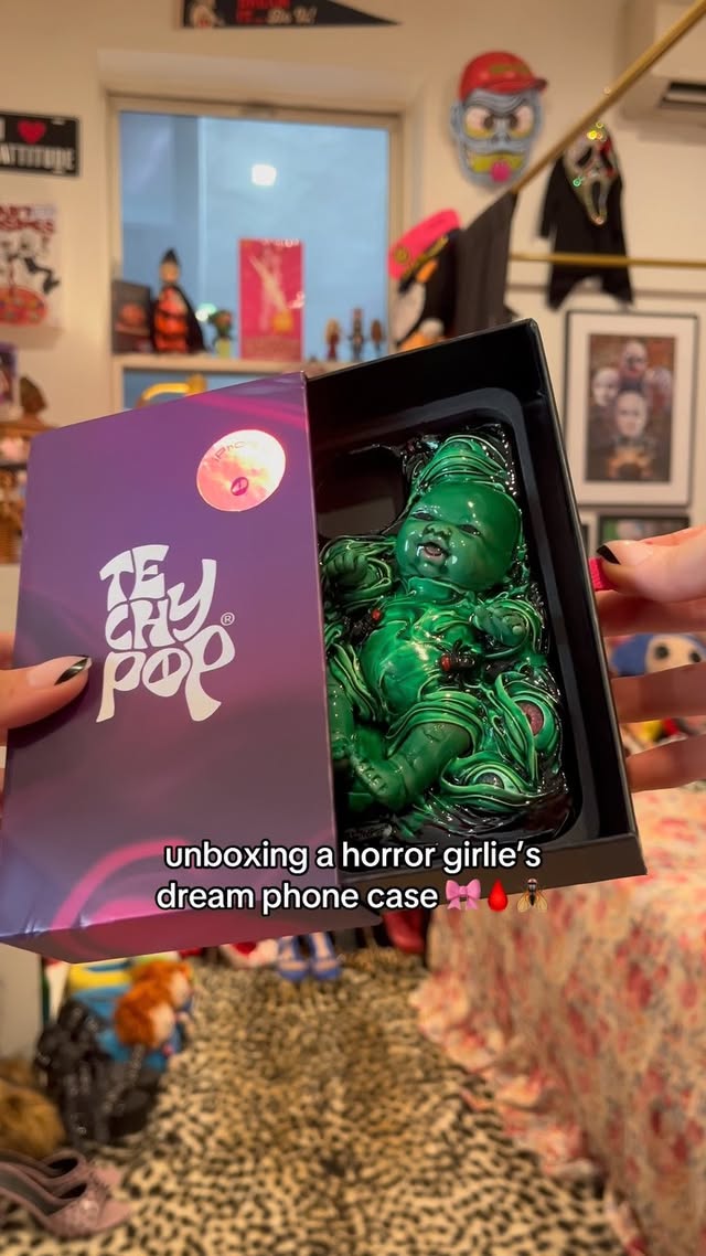 Instagram post by @onastaciaroe for Techypop. Caption reads: [...] with this creepy little baby case from....