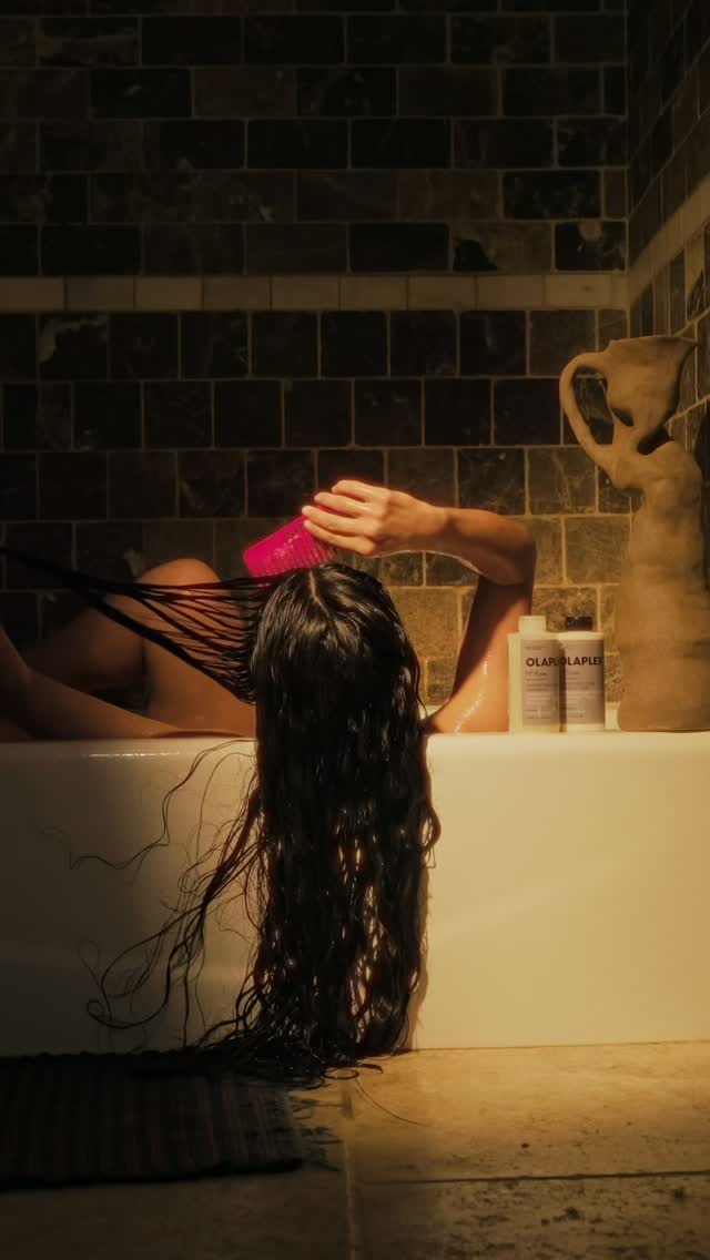 Instagram post by @theturmerictimes for OLAPLEX. Caption reads: [...] and protect to play It’s wash day with....