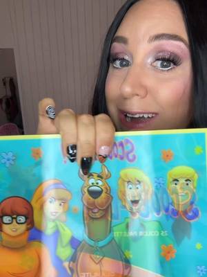 TikTok post by @iam_theniche for Glamlite Cosmetics. Caption reads: @Glamlite Scooby doo eyeshadow palette! #scoobydoo....