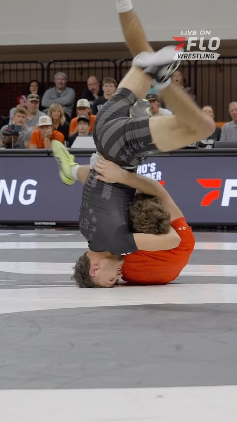 Instagram post by @kdtrainingcenter for FloWrestling. Caption reads: Gavin Mangano and Dean Anderson let it fly at 138....