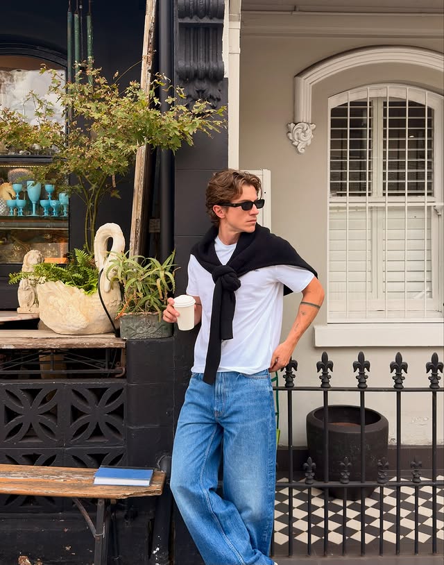 Instagram post by @joshuapaine for Calvin Klein. Caption reads: A week of fits in my @calvinklein baggy jeans. #ad.