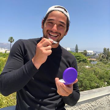 Instagram post by @alanbersten for SmileDirectClub. Caption reads: I’m all about showing my pearly whites and I’m now....