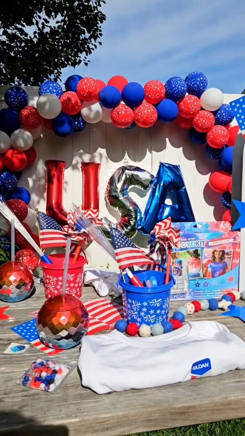 Instagram post by @ashleym.mclaughlin for Oriental Trading. Caption reads: [...] with this 4th of July set up with....