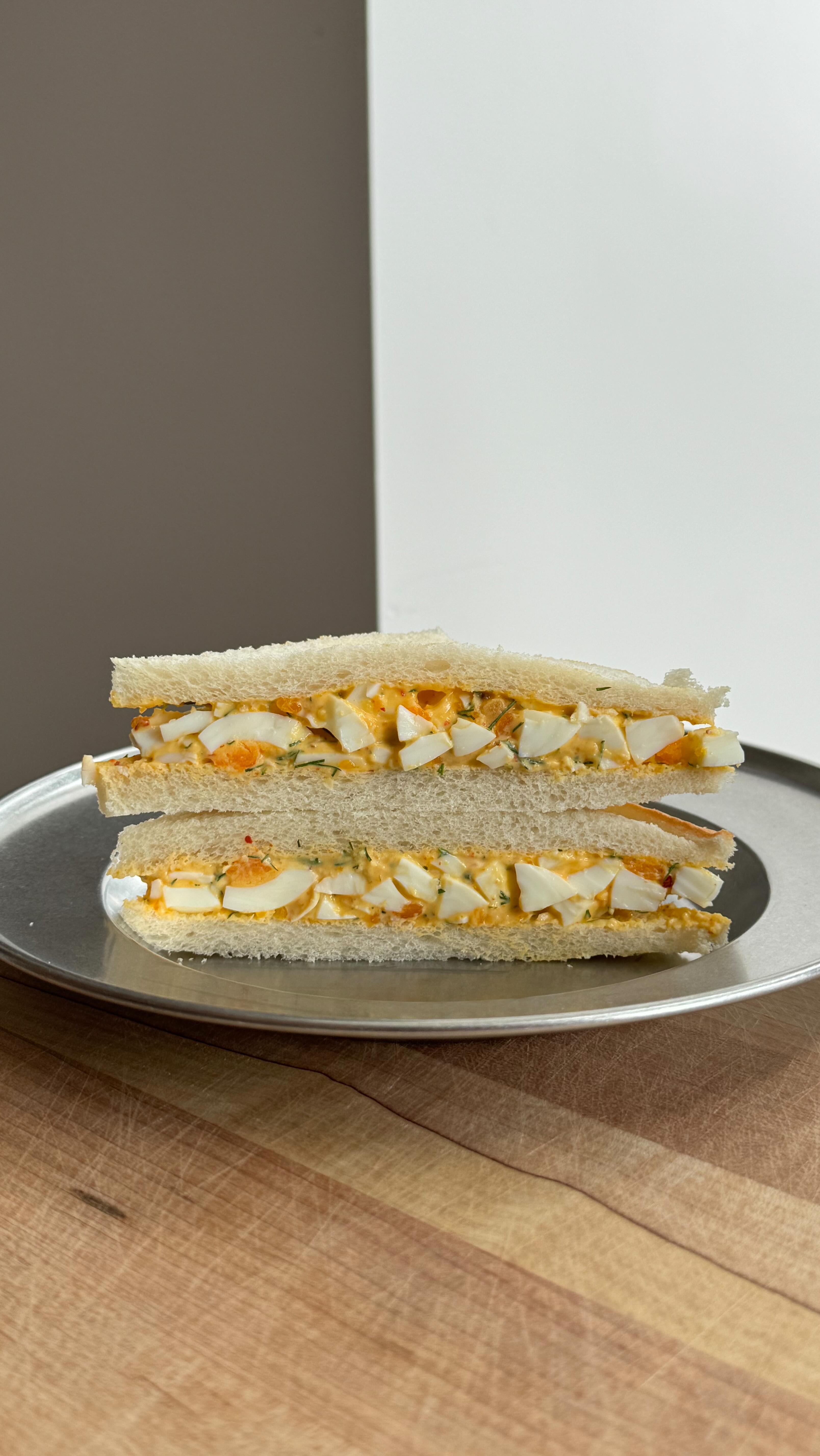 Instagram post by @zaynab_issa for NYT Cooking. Caption reads: One of my favorite breakfasts reimagined as an egg....