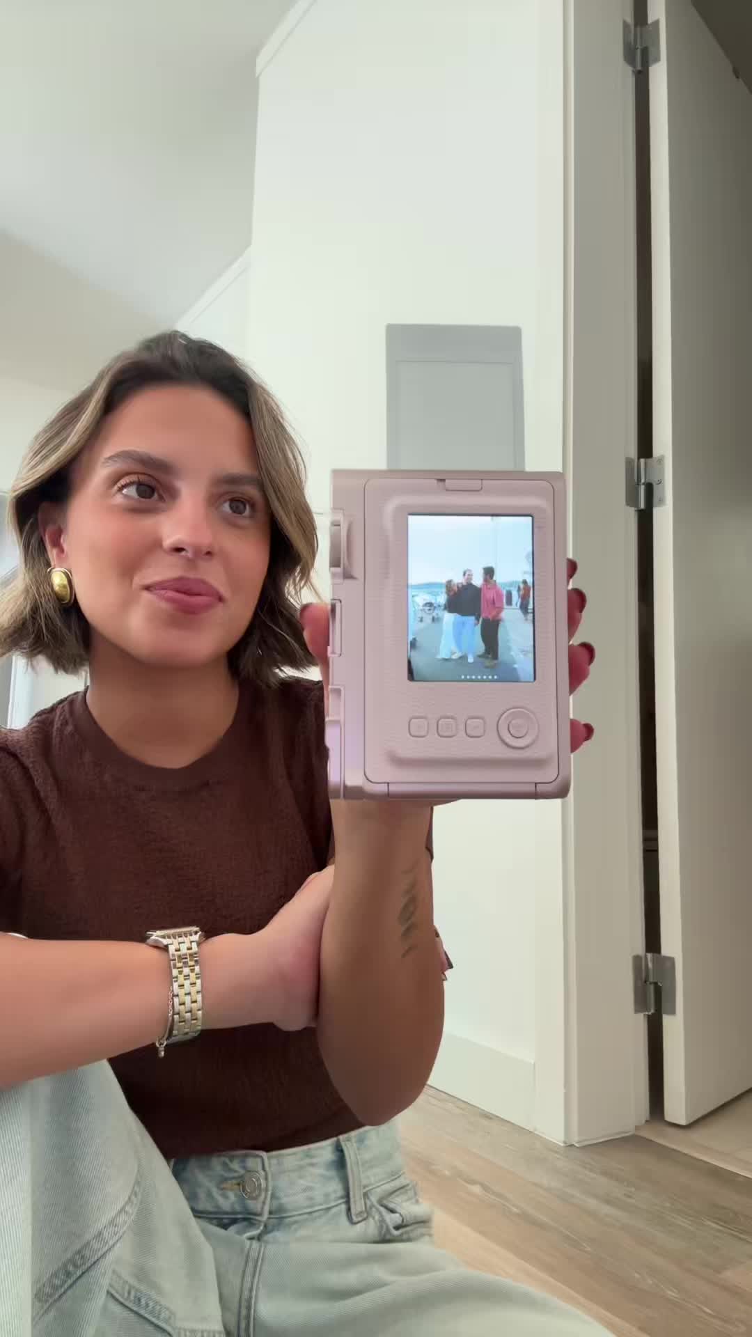 TikTok post by @matildepintolopes for Instax. Caption reads: [...] - 1 favorito  O vencedor de outubro: Instax....