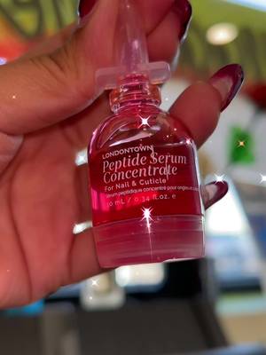 TikTok post by @n_a.n.c_y for LONDONTOWN. Caption reads: LONDONTOWN💗 Peptide Serum Concentrate for Nail &....