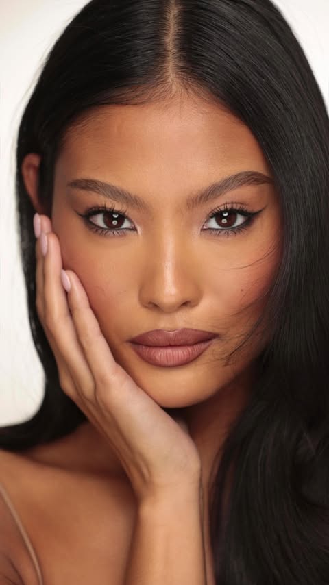 Instagram post by @nikki_makeup for Rare Beauty. Caption reads: Soft, glow-giving hydration. Just a touch of....