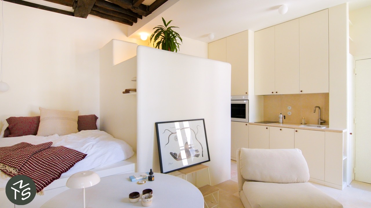 YouTube post by @nevertoosmall for Artlist. Caption reads: Smart Design Transforms Compact Paris Studio,....