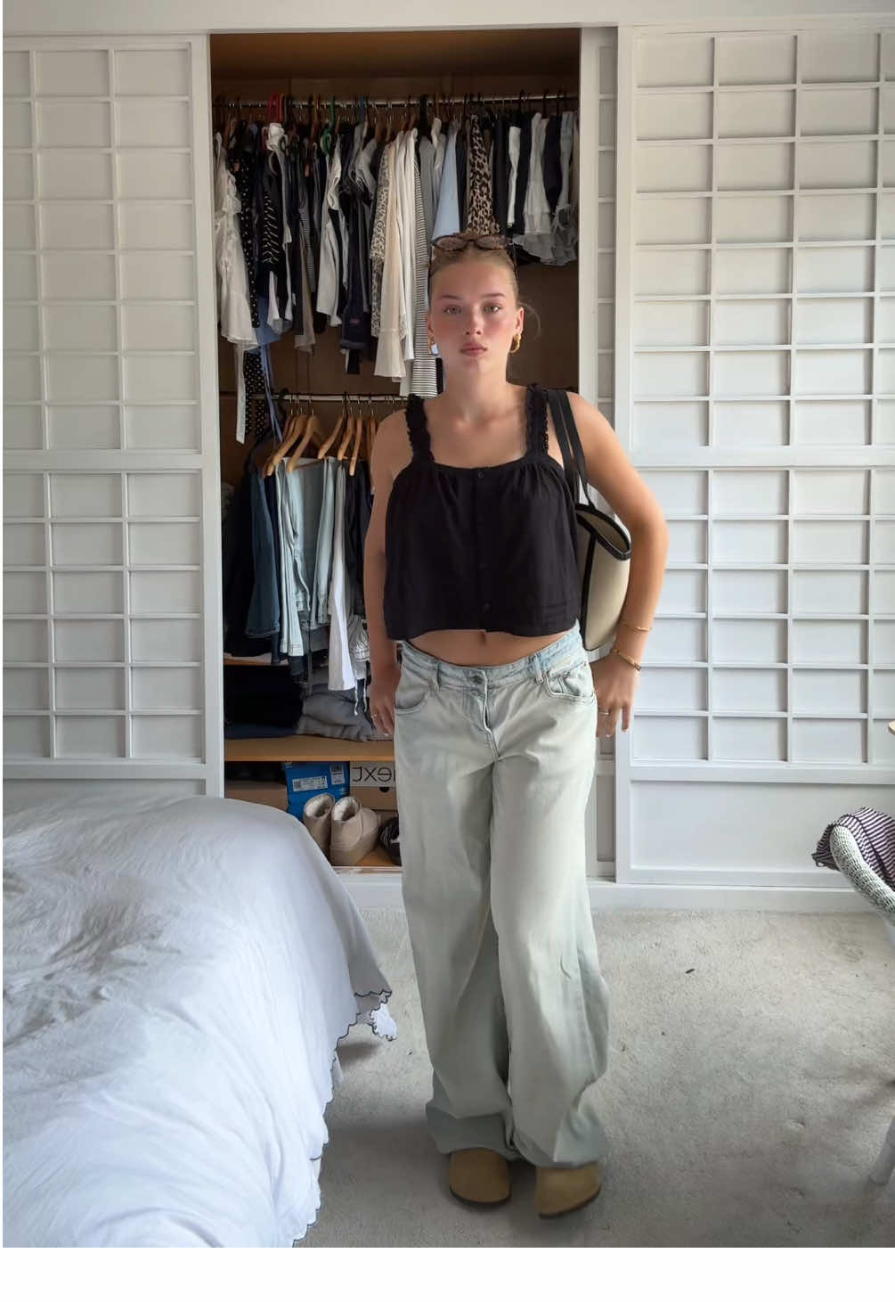 TikTok post by @poppyy.barrett for Lulu Guinness. Caption reads: styling my @Lulu Guinness bag w me!!xox #ootd #fyp....