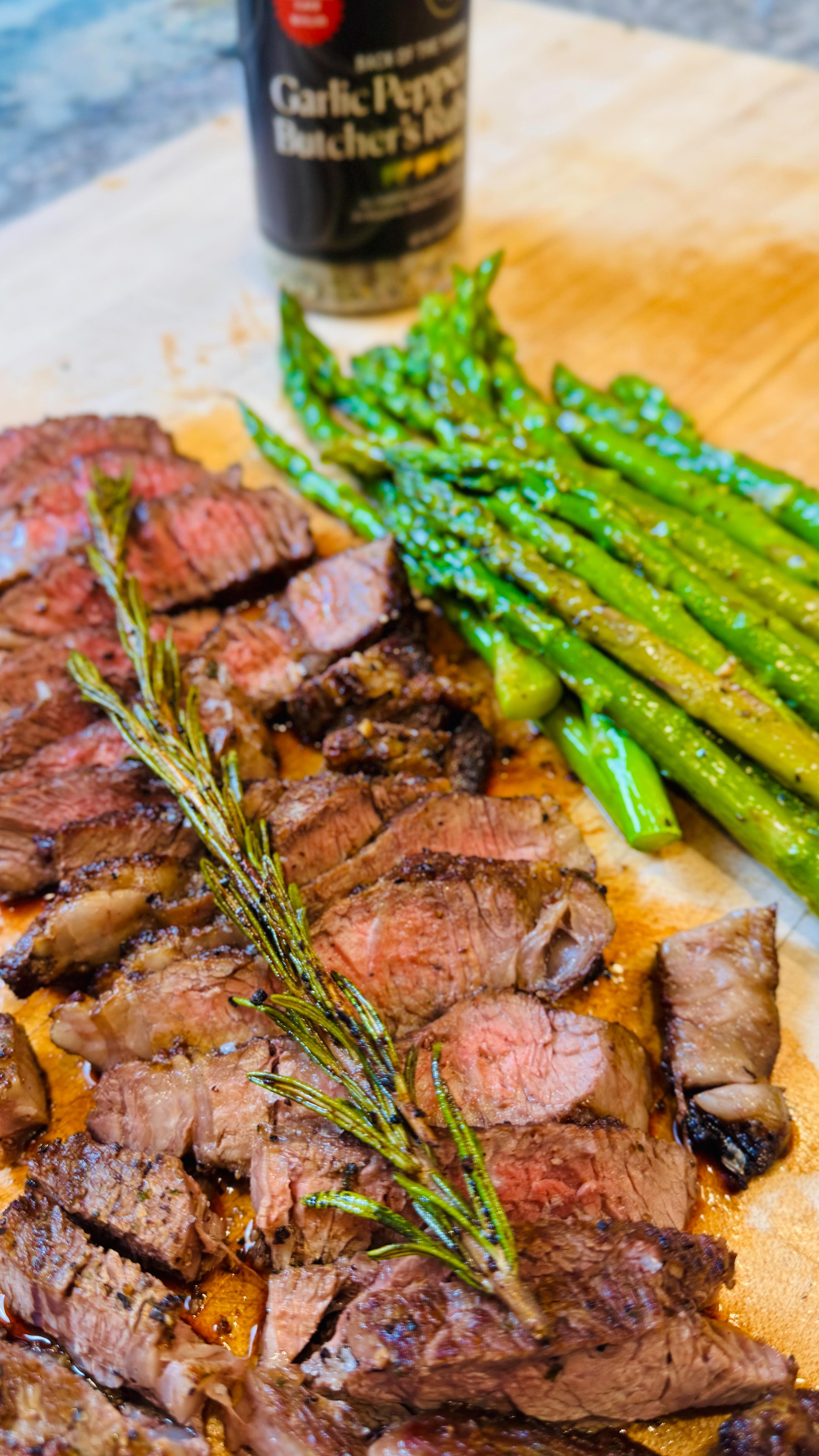 Instagram post by @costcokitchen for The Spice House. Caption reads: Ribeye + roasted asparagus = Weeknight steakhouse....
