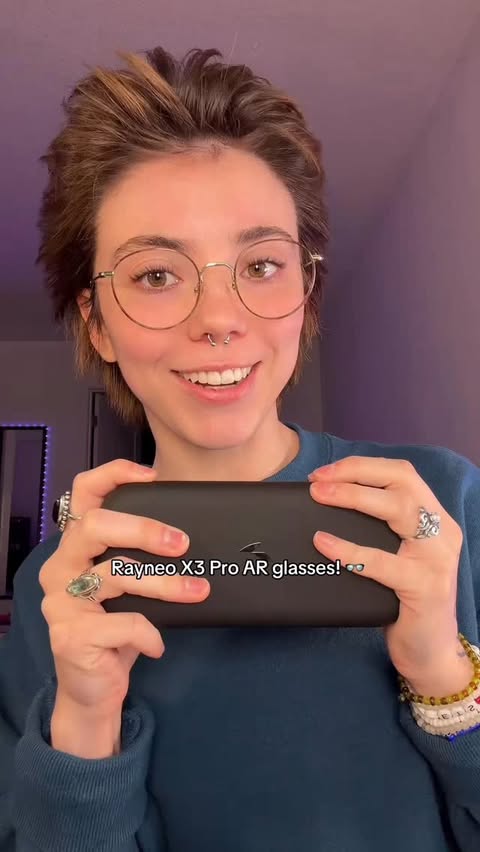 Instagram post by @reddnea for RayNeo. Caption reads: [...] just keeps getting cooler!👓 #sponsored....