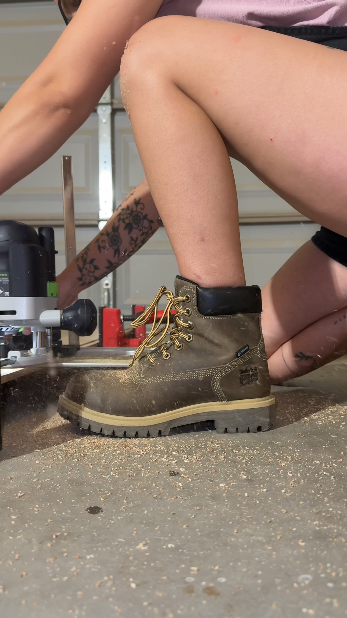 Instagram post by @rainanicolewoodworks for Timberland PRO. Caption reads: @rainanicolewoodworks finishing off a bookshelf in....