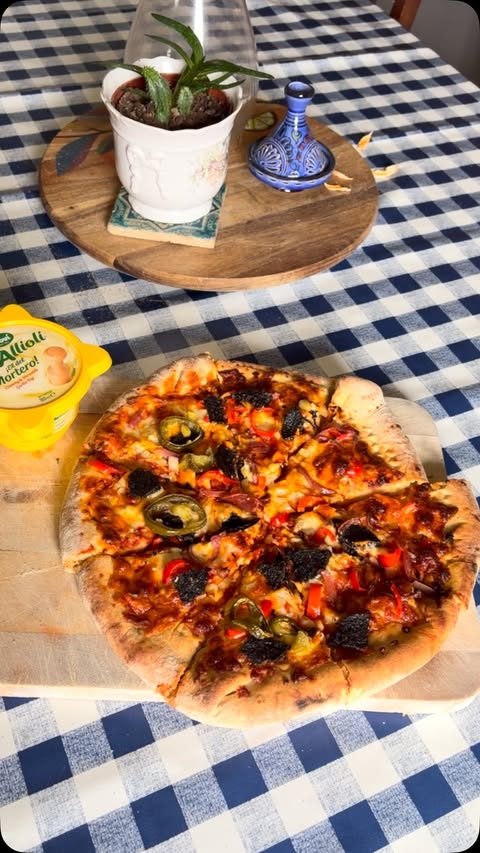 Instagram post by @asmalltown_wife for BrewDog. Caption reads: [...] pairing? Homemade pizza with a....