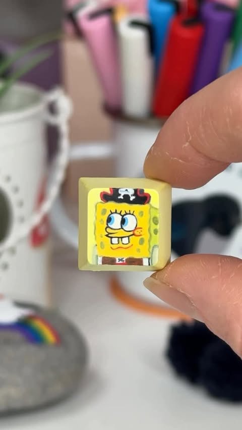Instagram post by @celynhaf for Paramount Pictures. Caption reads: Painting a SpongeBob SquarePants keycap on my....
