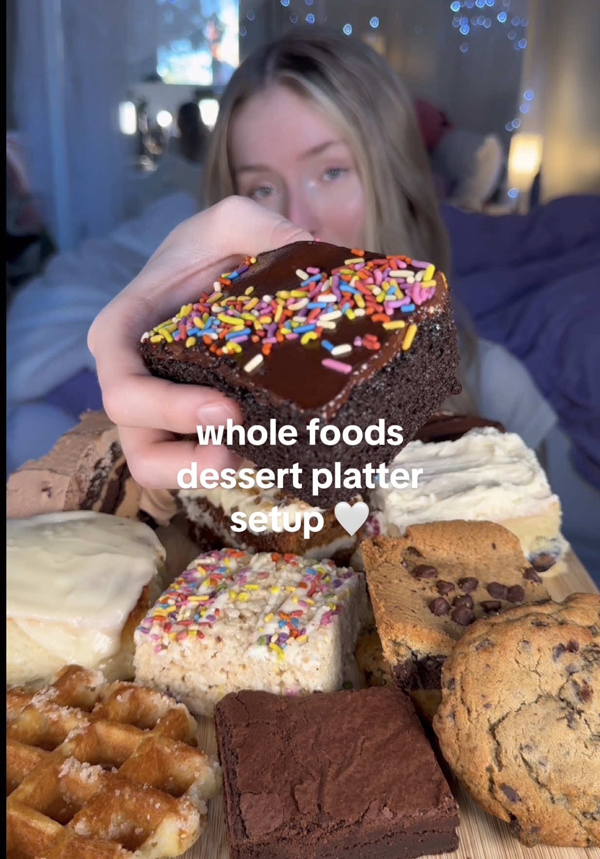 TikTok post by @sarahjeaneats for Whole Foods Market. Caption reads: let’s set up a platter with EVERY dessert from....
