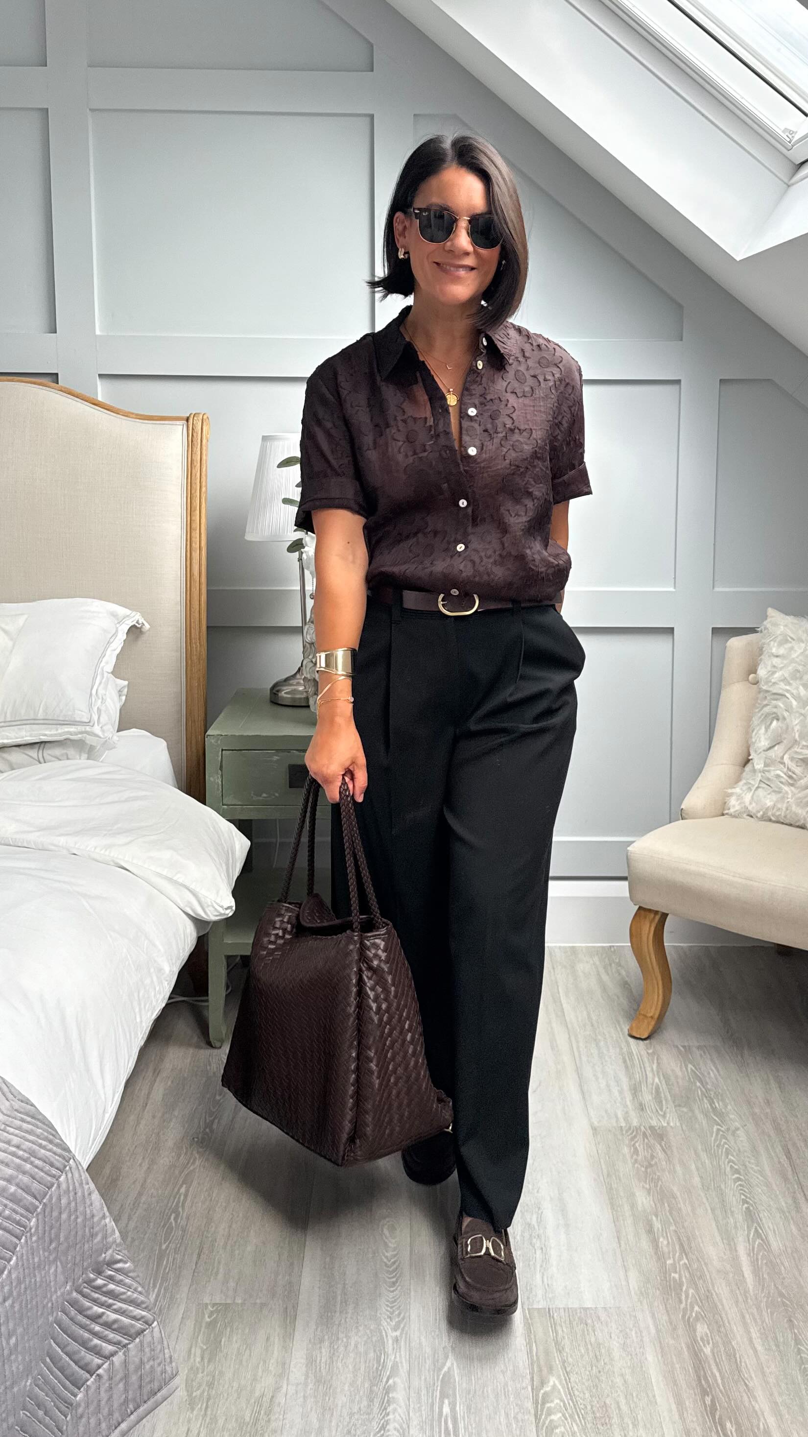 Instagram post by an influencer for Katie Loxton. Caption reads: [...] loafers. Woven bag is by Katie Loxton,....