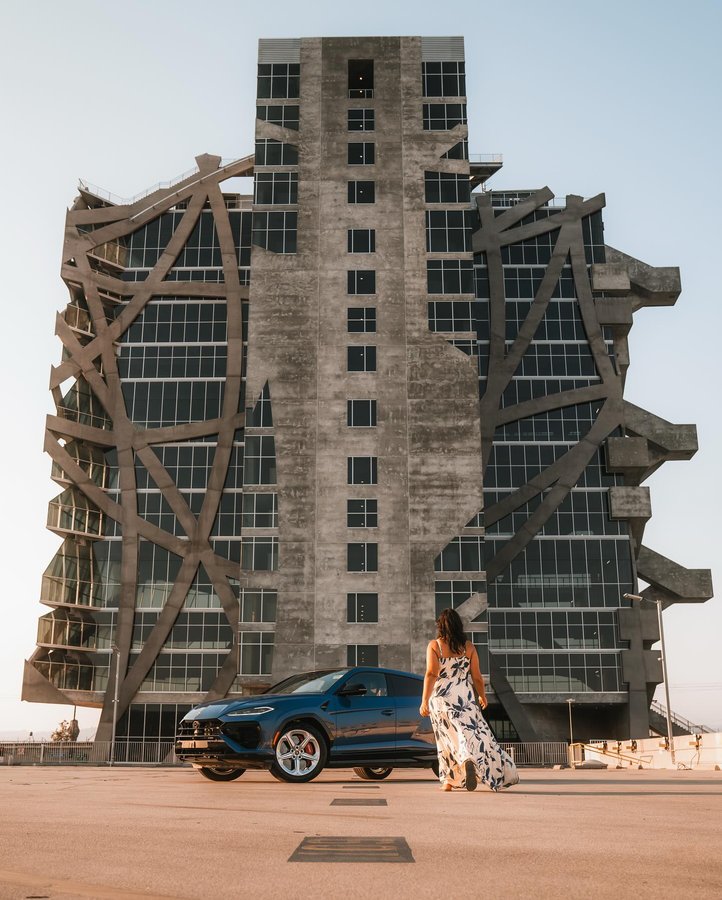 Instagram post by @asteryx for Lamborghini. Caption reads: Beneath the arches of a city built on grit, a blue....