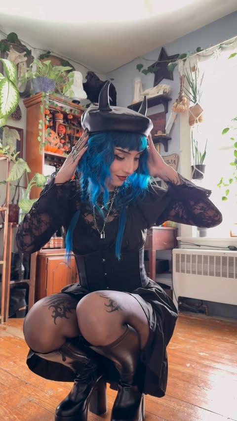 Instagram post by @witchy_womaan for Scarlet Darkness. Caption reads: [...] Short sleeve dress and corset from....
