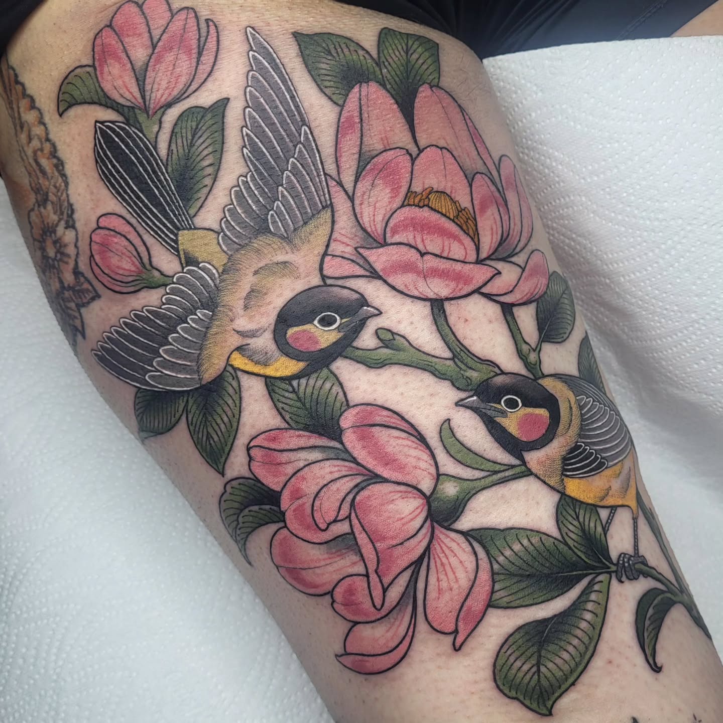 Instagram post by @ali_burke_tattoo for Butterluxe Tattoo Care. Caption reads: Siobhan got the back of her thigh BLASTED today....