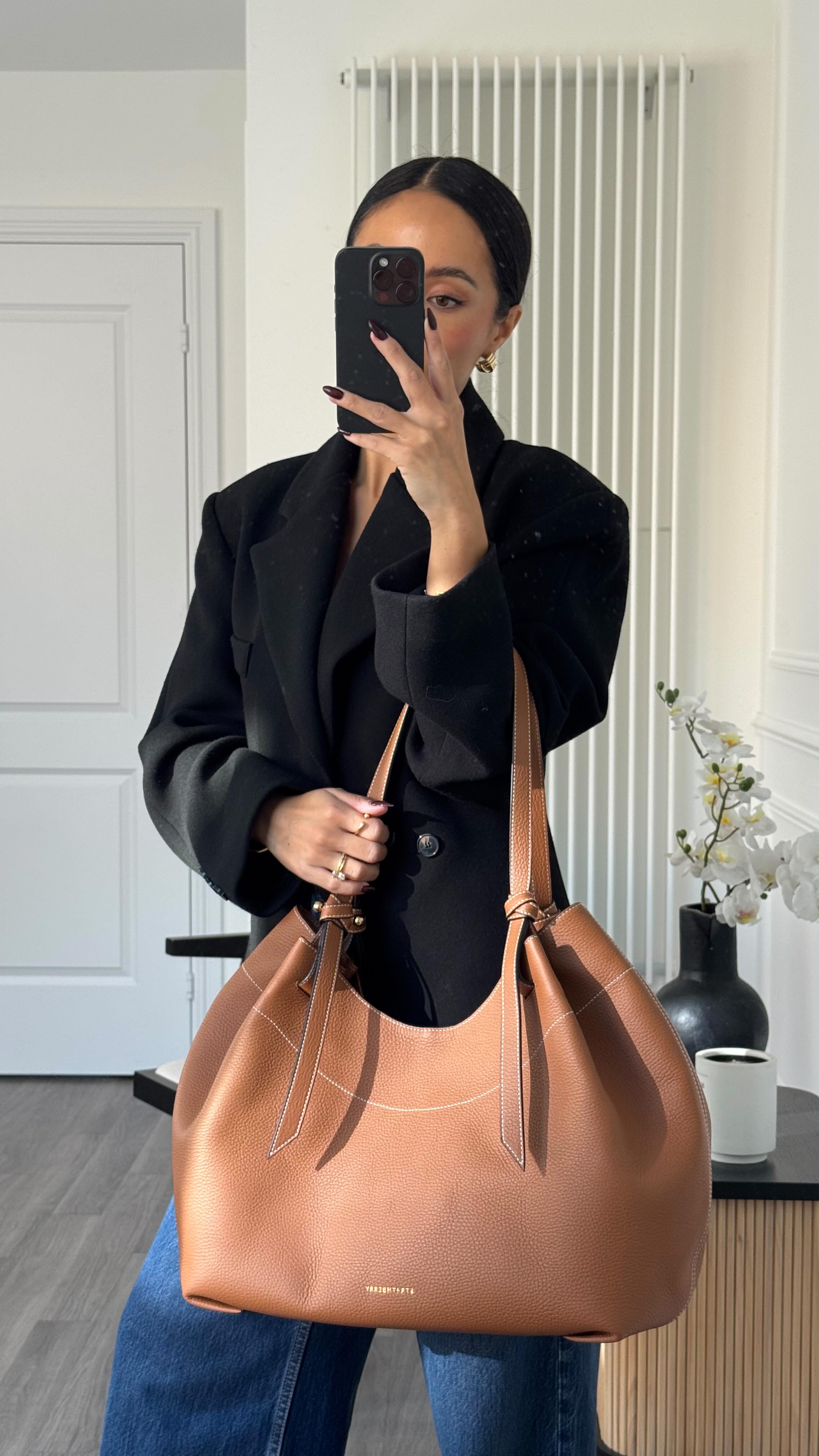 Instagram post by @ooliviamiller for Strathberry. Caption reads: ad What to wear for: autumn outfit inspo 🍂....