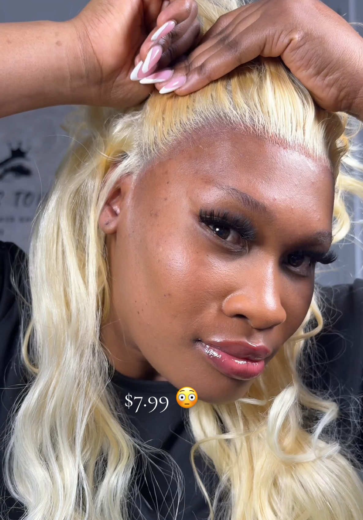 TikTok post by @real_makiki for KISS Colors & Care. Caption reads: If your wig lifts watch this Kiss lace bond spray....