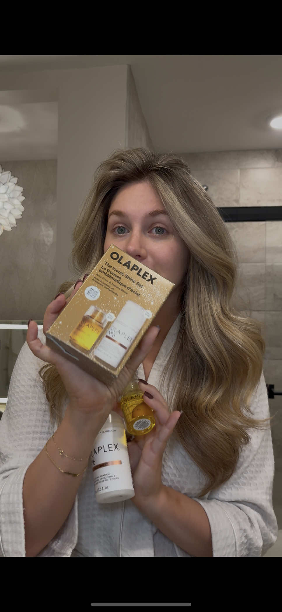 TikTok post by @megslifebelike for OLAPLEX. Caption reads: date night hair w/ @Olaplex ✨ smooth, shiny, and....