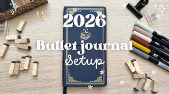 YouTube post by @bujobyfilo for Ellington Pens. Caption reads: 2026 Bullet Journal setup Plan with me 🐑⭐.