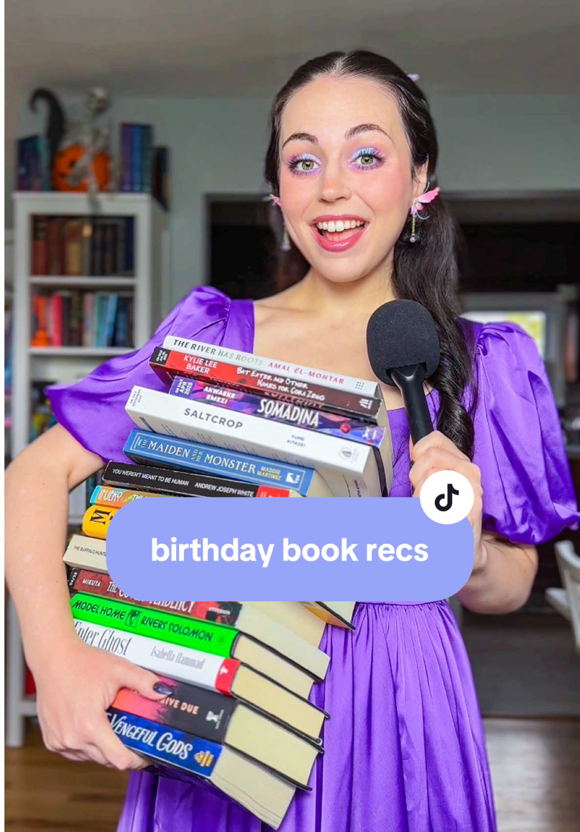 TikTok post by @starrysteph for Aora Makeup. Caption reads: 11/11 is 👹STEPH DAY 👹!! 📚 books mentioned: -....