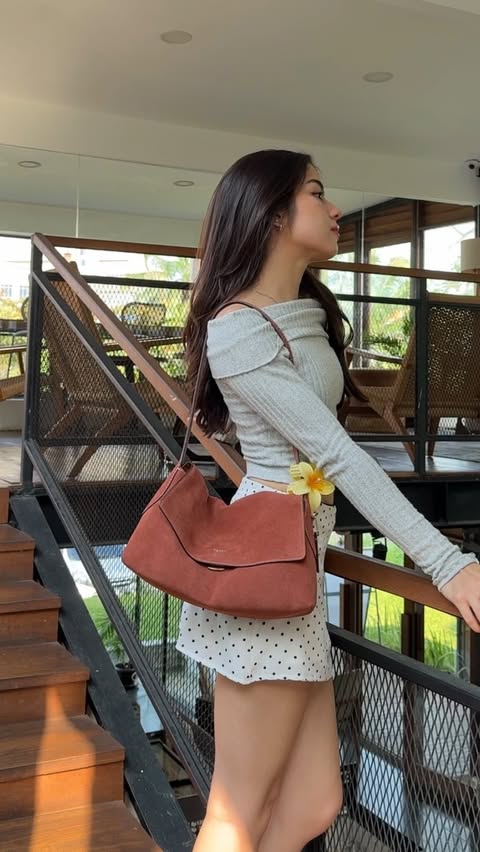 Instagram post by @valeryverhey for Coach. Caption reads: coffee break☕️ #CoachNY #CoachIndonesia @coach....