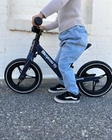 Instagram post by @xochitl_puga for Joovy. Caption reads: [...] Love watching her ride around in her @joovy....